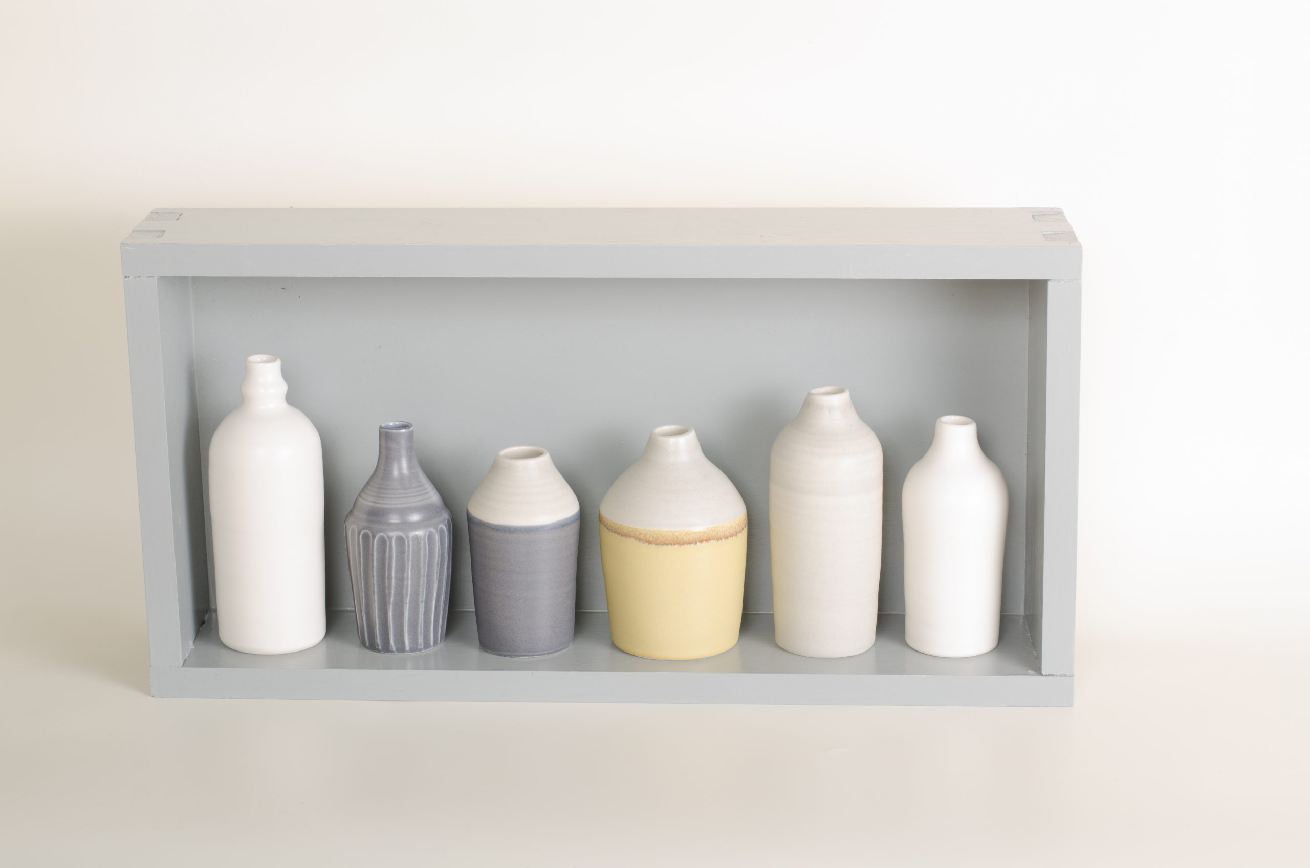 Hand thrown bottles, in white, grey, black and mustard, inspired by morandi paintings.