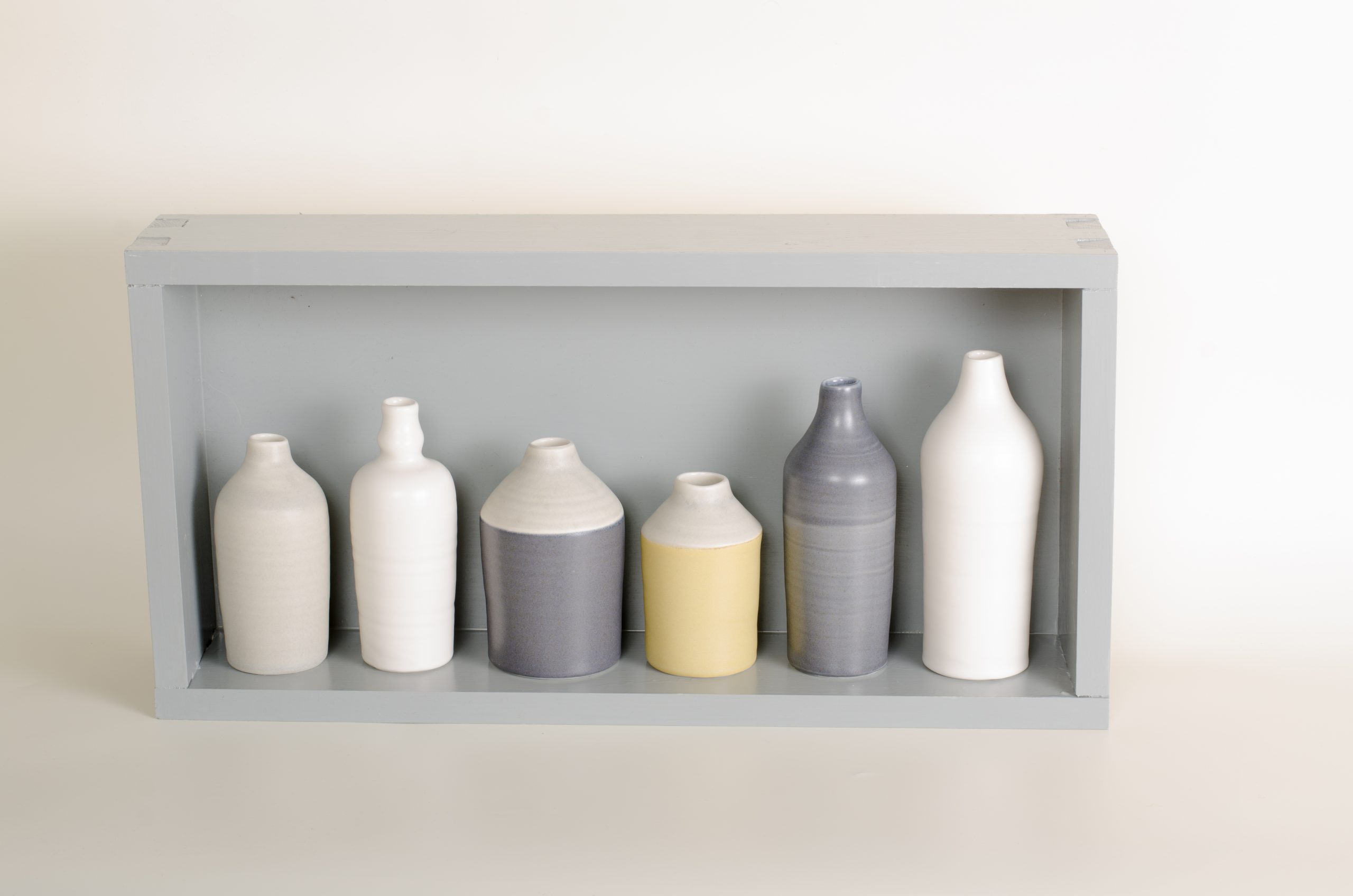 Hand thrown bottles, in white, grey, black and mustard, inspired by morandi paintings.