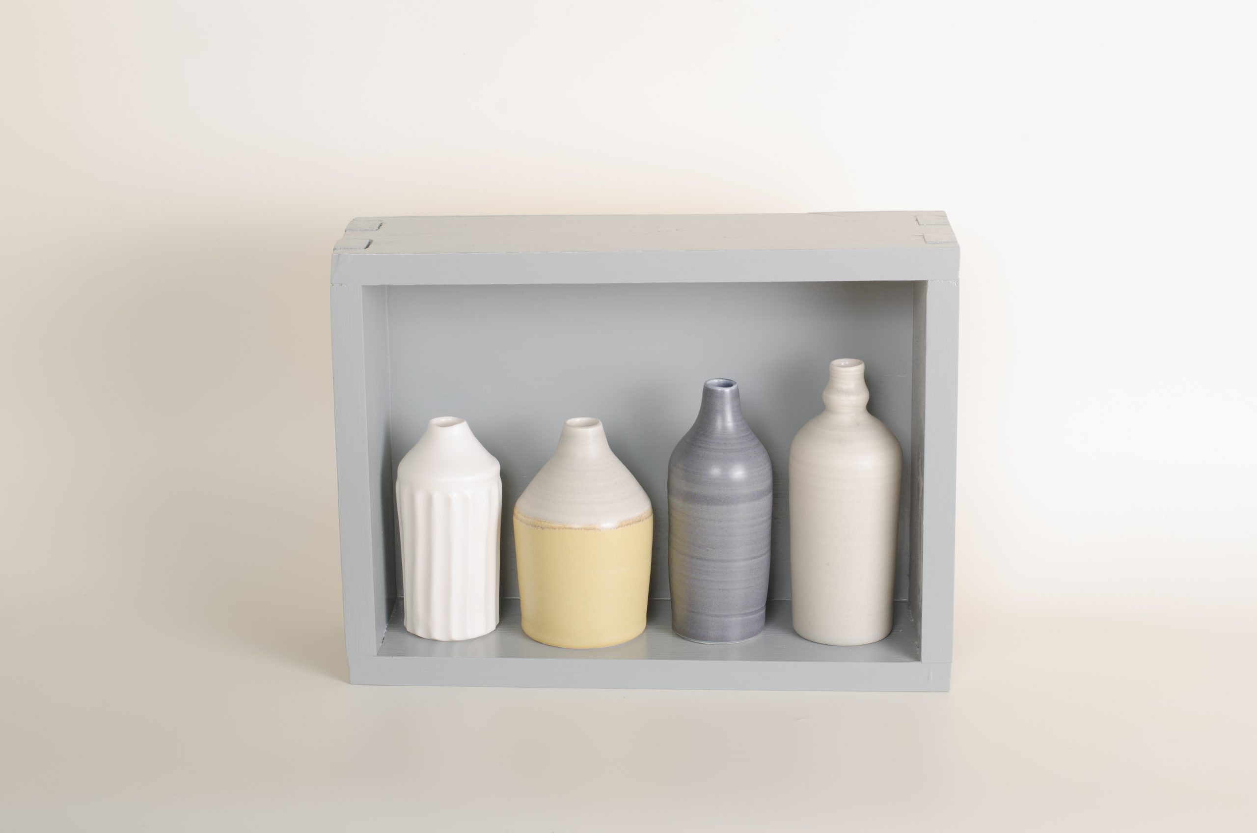 Hand thrown bottles, in white, grey and mustard, inspired by morandi paintings.